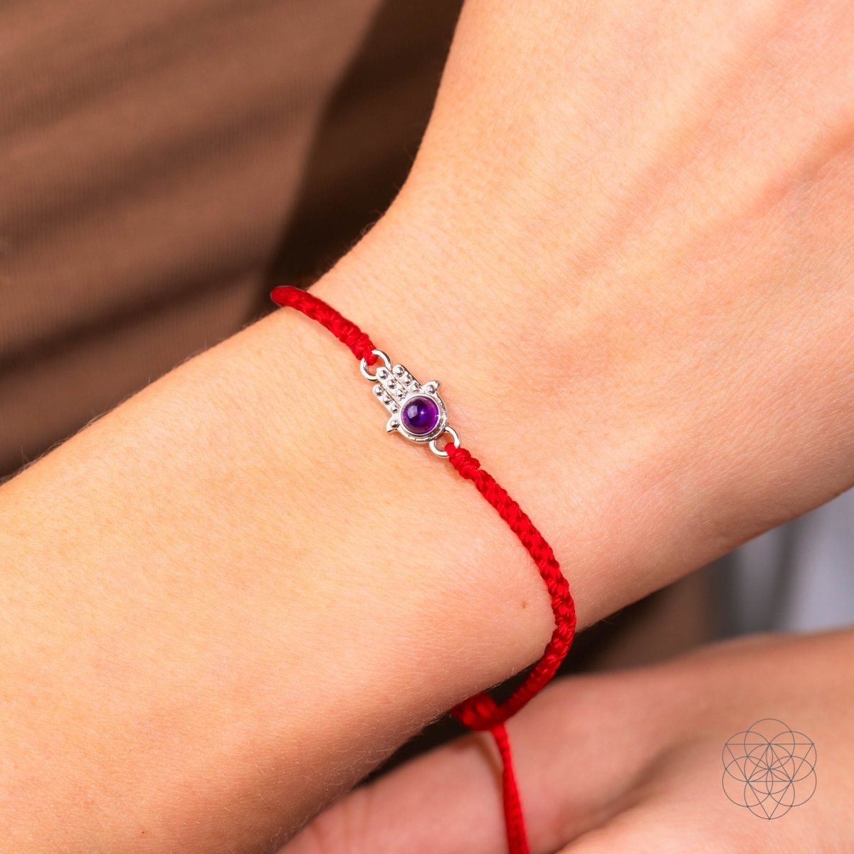 Four-strand red string bracelet with a silver-plated hamsa hand charm set with a purple Brazilian amethyst — detail view 3