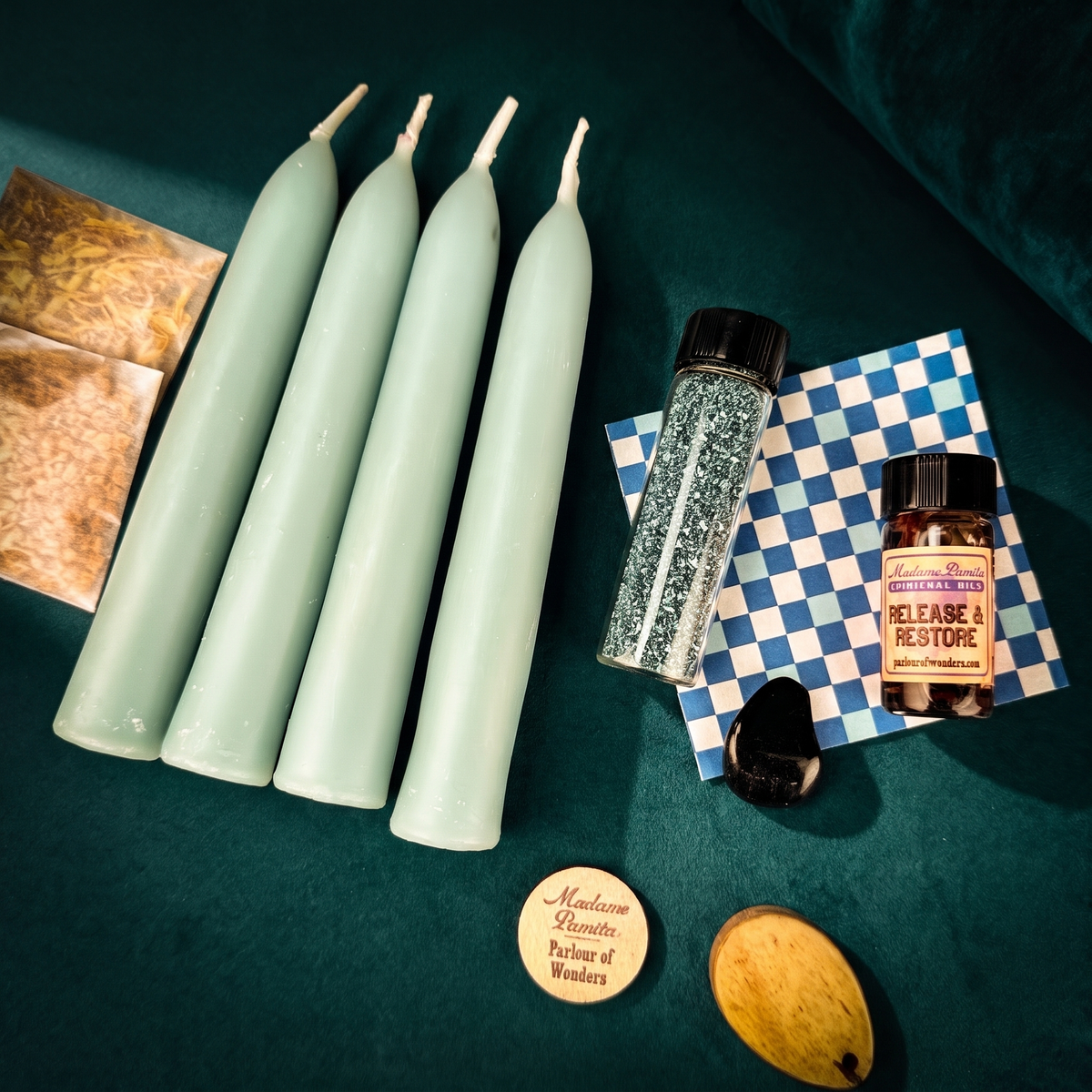 Renewal Candle Spell Booster Pack with four blue beeswax tapers, Release and Restore oil, herbs, tumbled gemstone and blue glass glitter