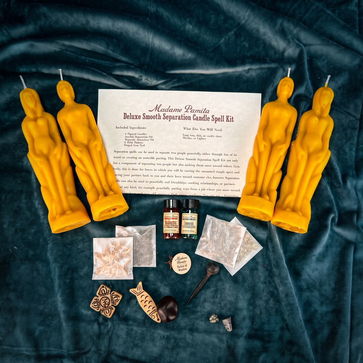 Deluxe Smooth Separation Candle Spell Kit laid out with four beeswax figure candles, forged nail, four herbs, two oils and instructions