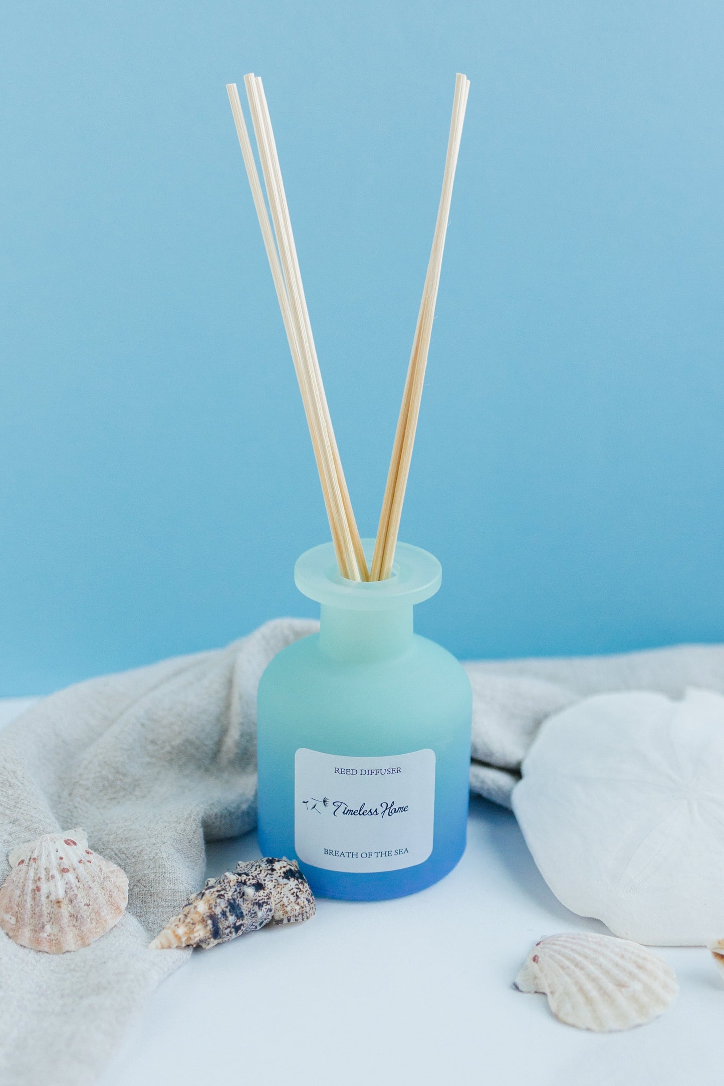 Breathe of the Sea reed diffuser in a frosted glass vessel with five natural reed sticks — view 4