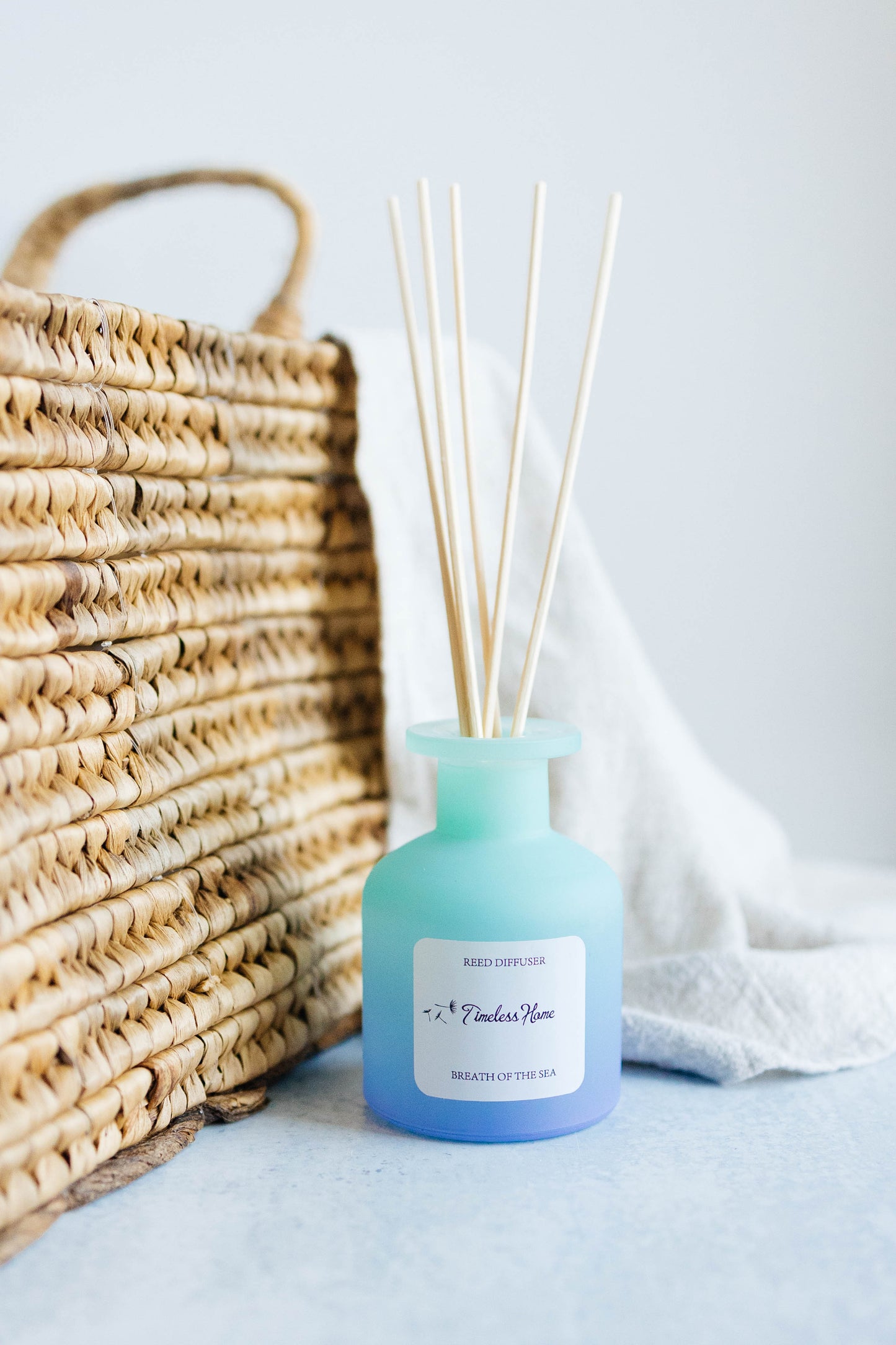 Breathe of the Sea reed diffuser in a frosted glass vessel with five natural reed sticks — view 5