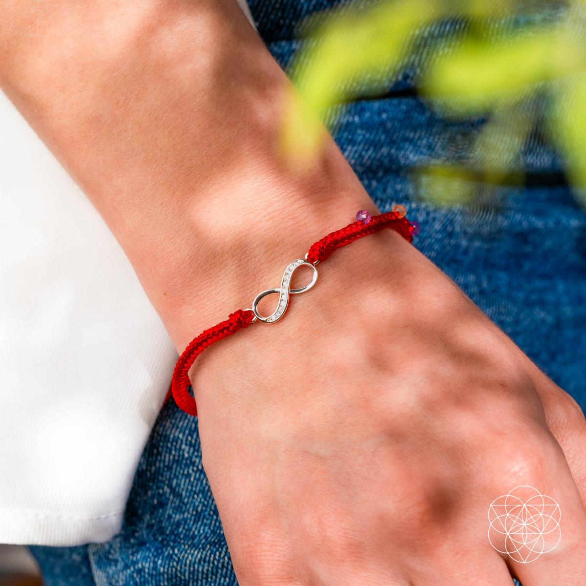 Eight-strand red string bracelet with a sterling silver infinity charm, citrine and amethyst beads — detail view 3