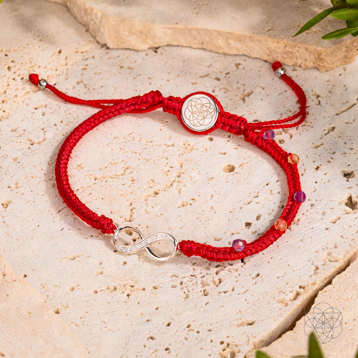 Eight-strand red string bracelet with a sterling silver infinity charm, citrine and amethyst beads