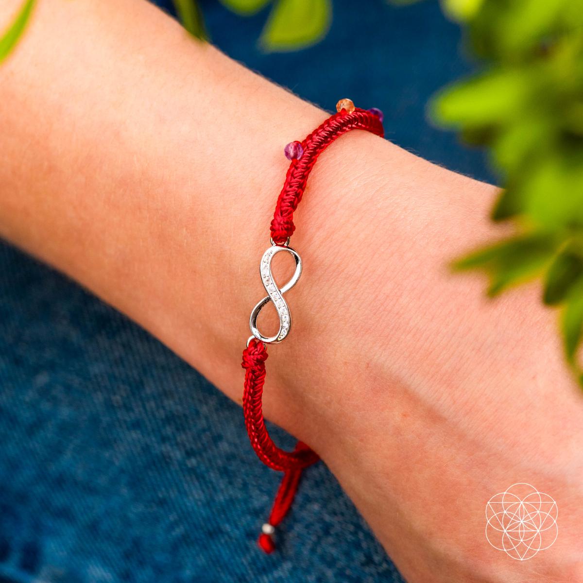 Eight-strand red string bracelet with a sterling silver infinity charm, citrine and amethyst beads — detail view 2