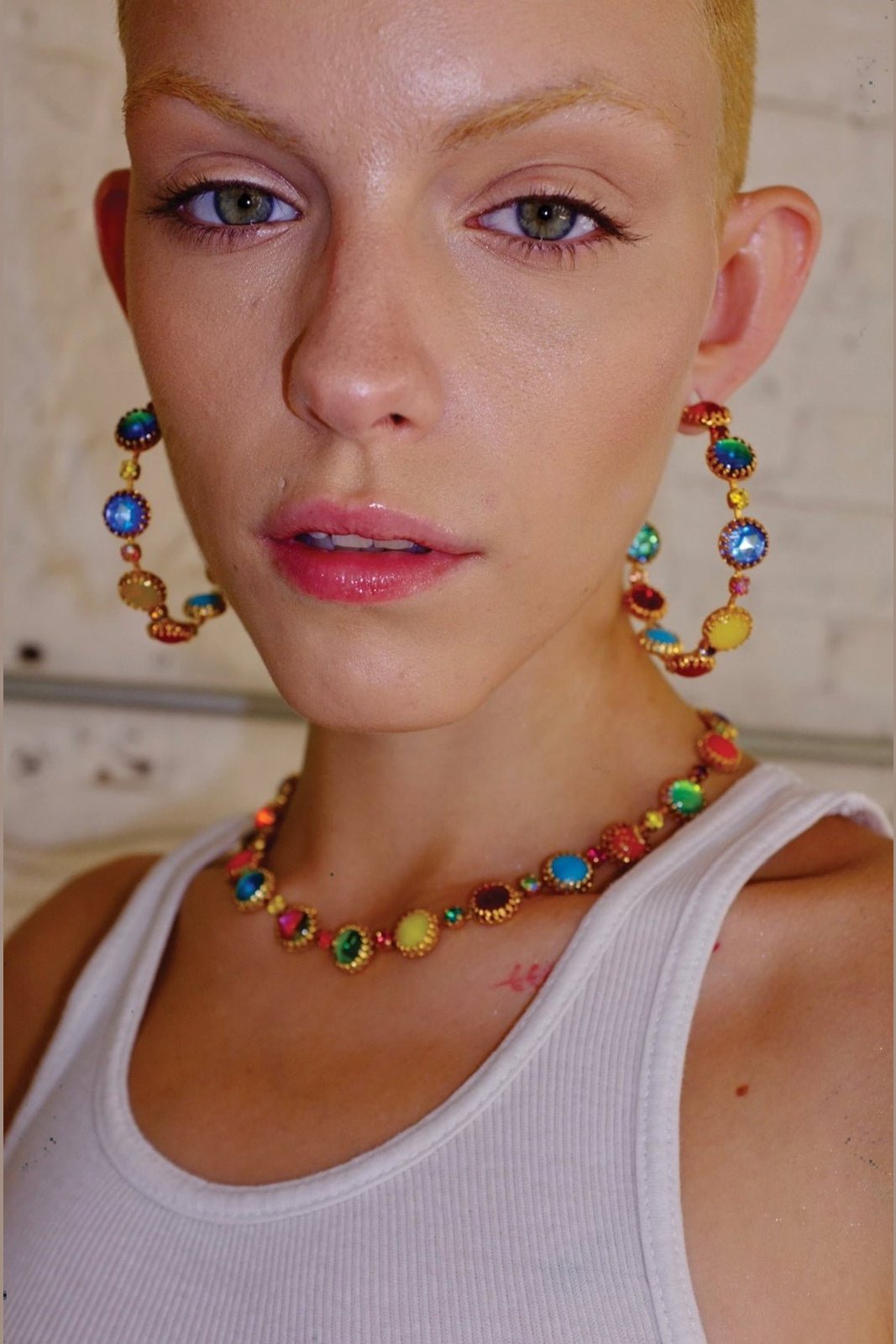 Detail of neon, opal and jewel-toned prismatic glass stones