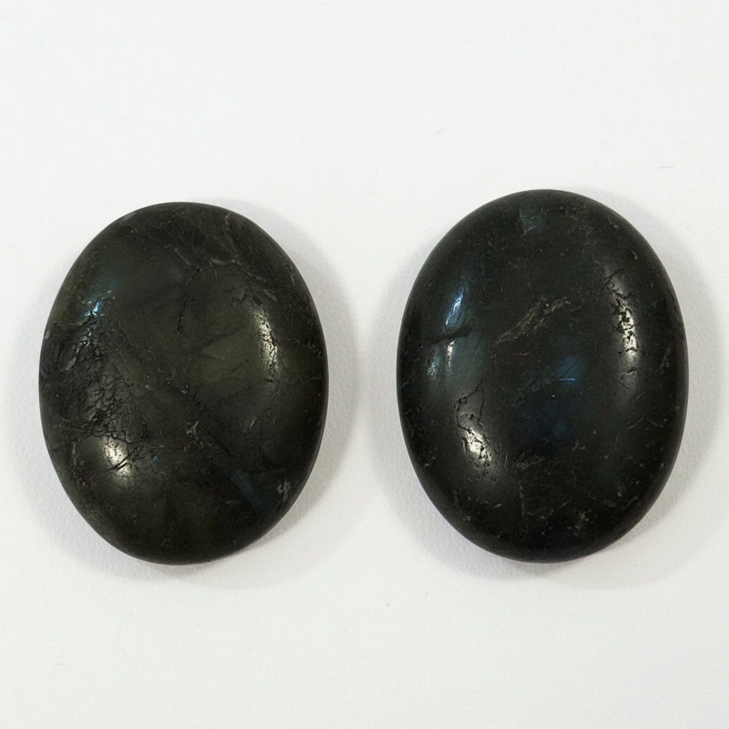 Labradorite comfort stone flashing blue and gold iridescence in the light, alternate view