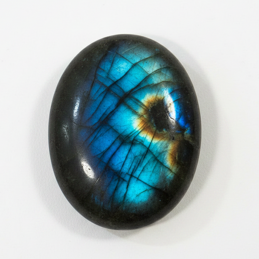 Labradorite comfort stone flashing blue and gold iridescence in the light