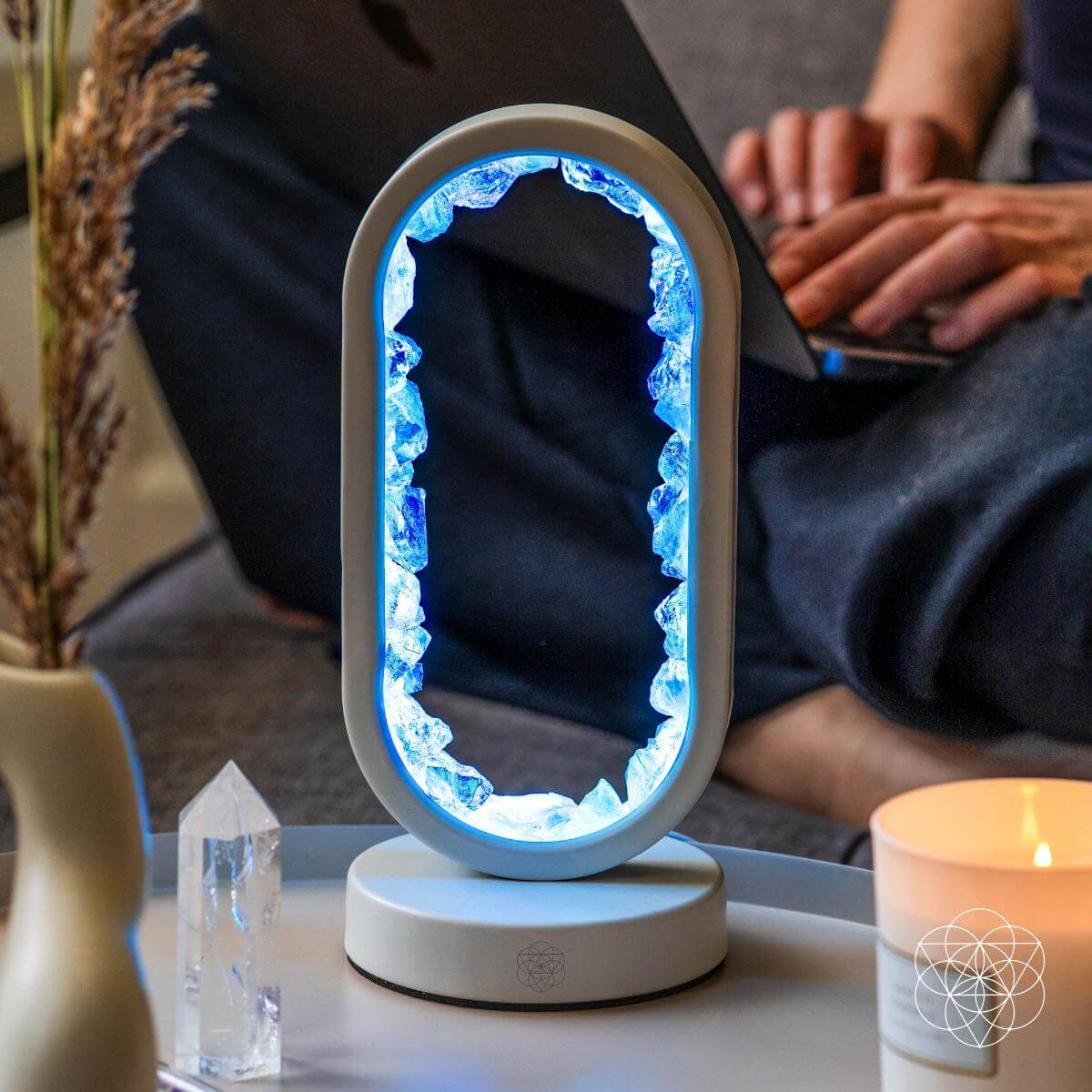Aura-plated clear quartz lamp glowing in deep blue hues — detail view 2