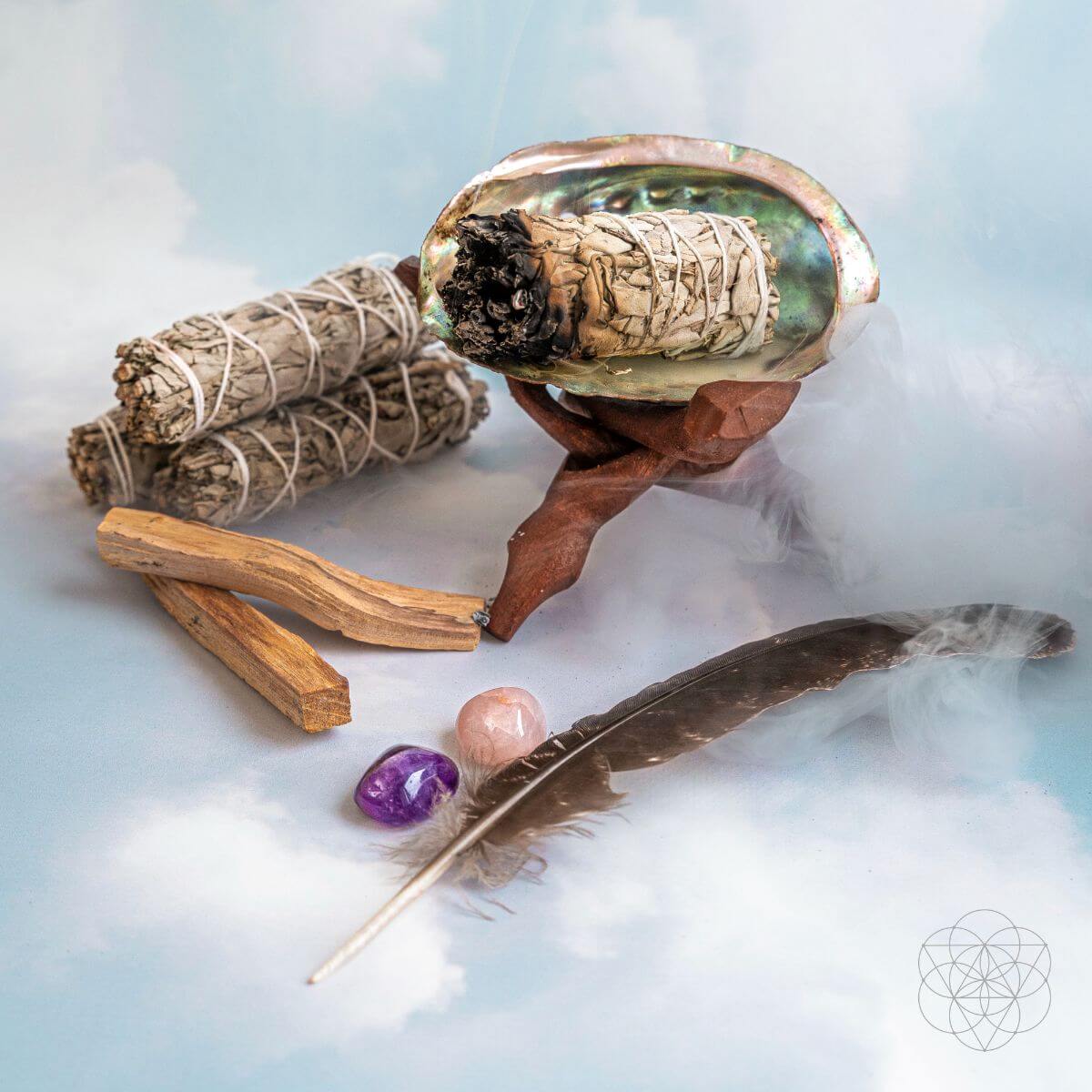 Master Cleanse deluxe smudging kit with white sage, palo santo, abalone shell, feather and crystals on a wooden stand — view 3 of 6