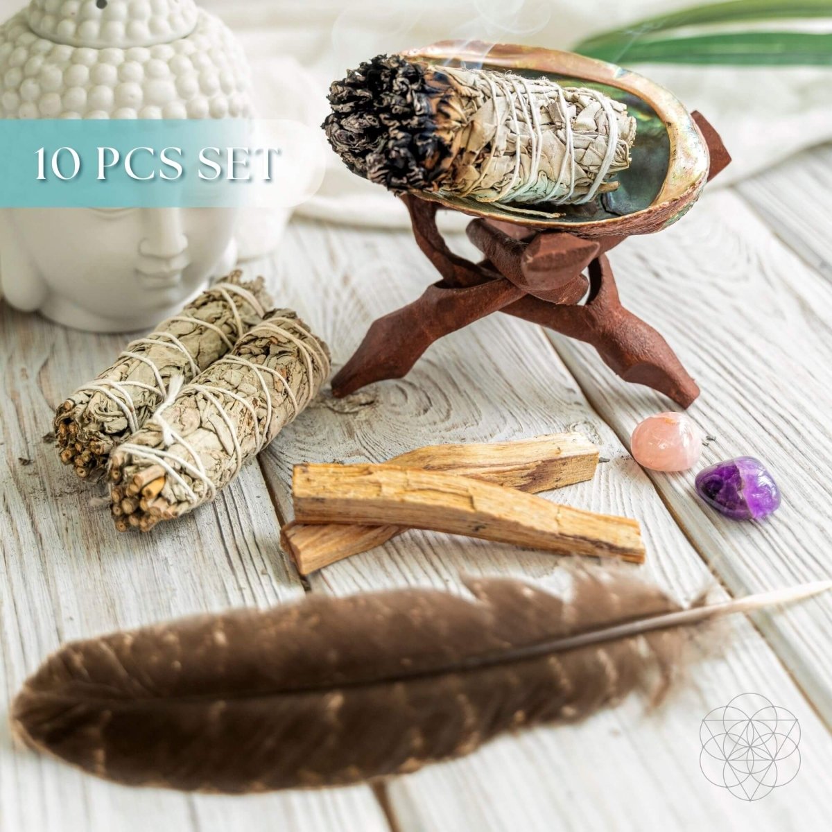 Master Cleanse deluxe smudging kit with white sage, palo santo, abalone shell, feather and crystals on a wooden stand — view 1 of 6