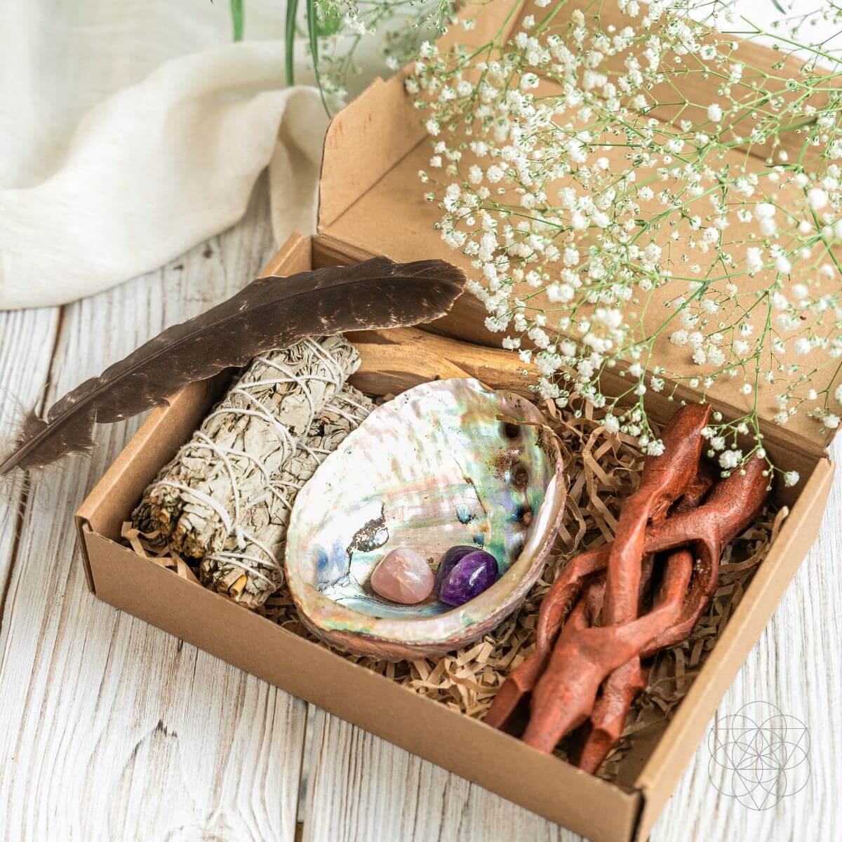 Master Cleanse deluxe smudging kit with white sage, palo santo, abalone shell, feather and crystals on a wooden stand — view 4 of 6