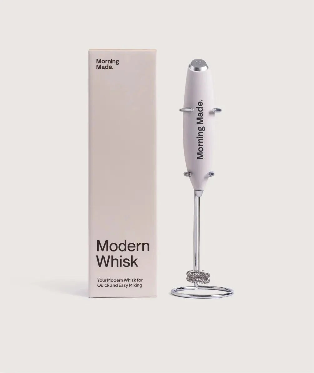 Modern stainless steel electric matcha whisk with countertop stand
