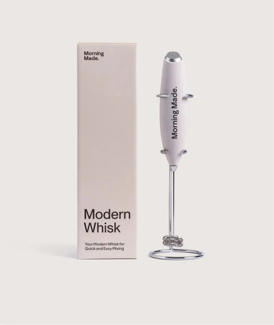 Modern stainless steel electric matcha whisk with countertop stand