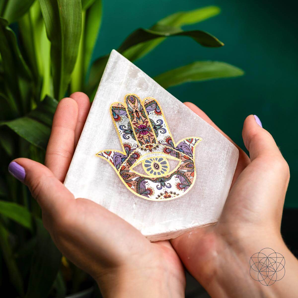 Selenite mood lamp topped with a Hamsa Hand talisman — view 2