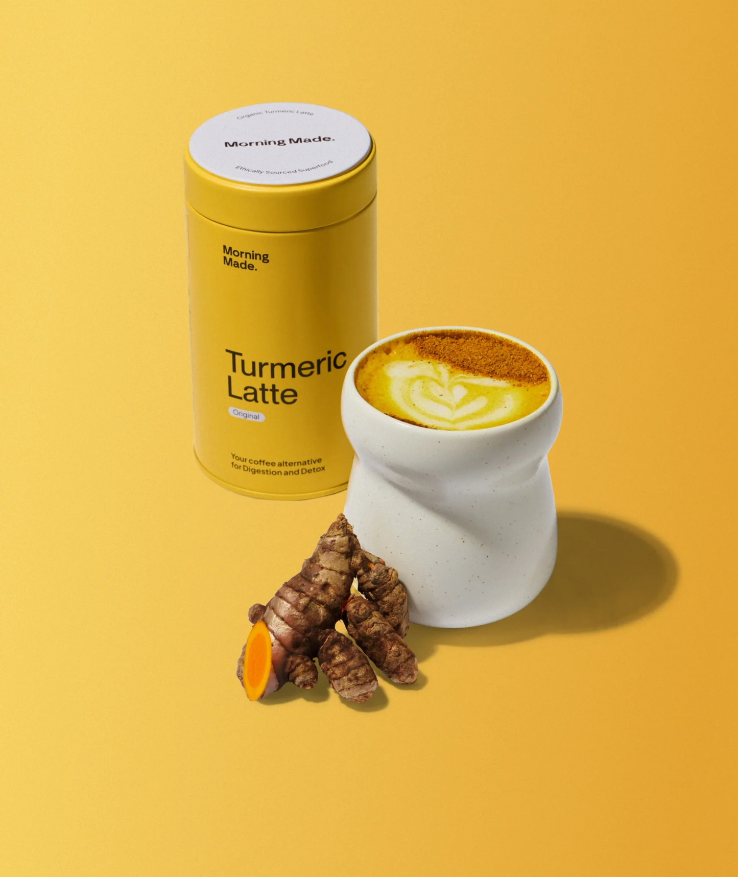 Golden turmeric latte poured into a glass