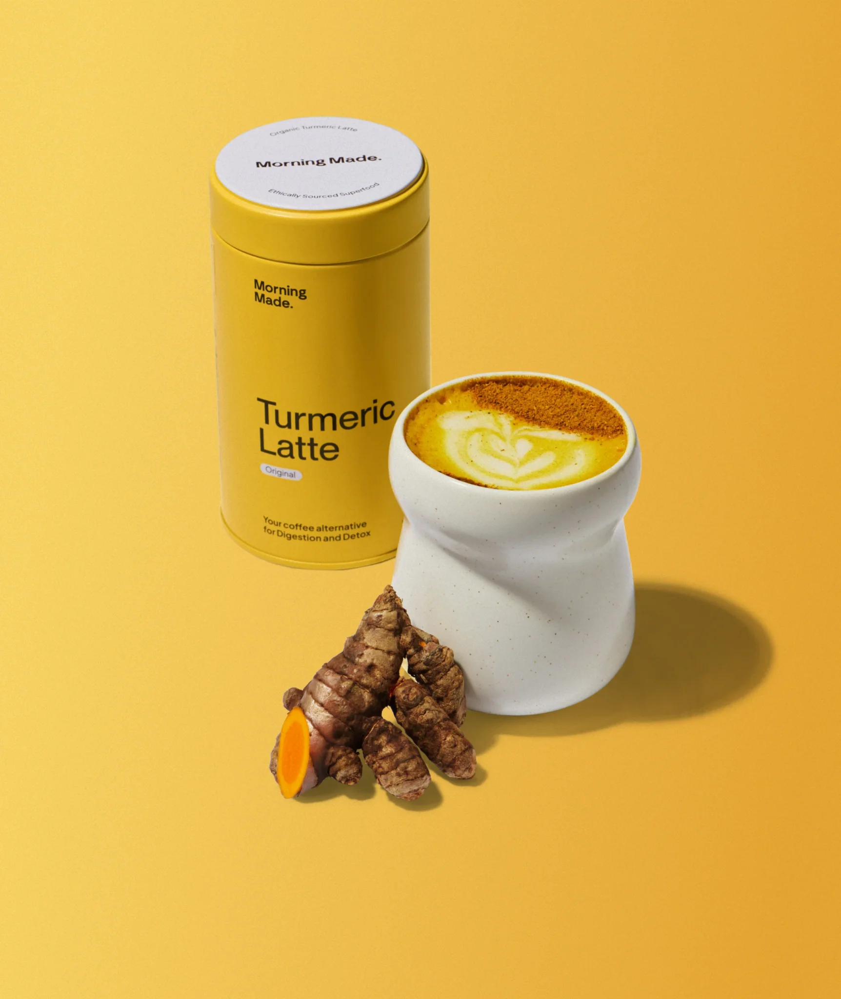 Golden turmeric latte poured into a glass