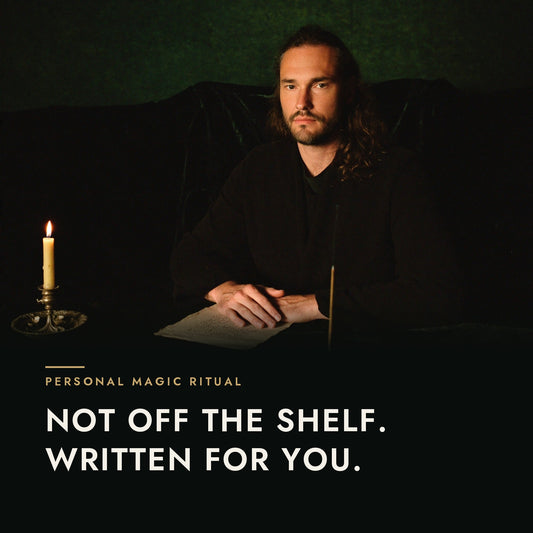 Leif Daniel at his desk by candlelight — Personal Magic Ritual: not off the shelf, written for you.