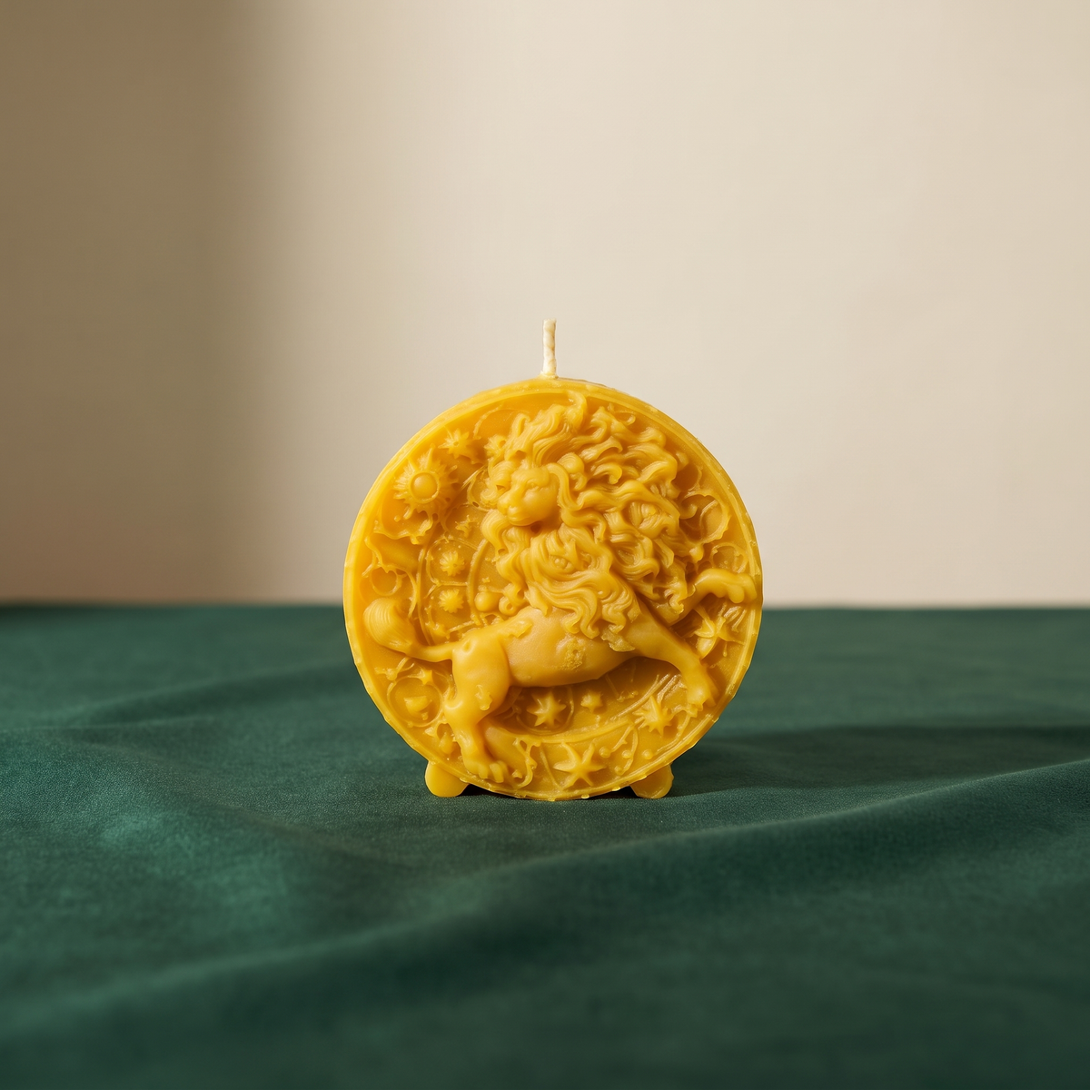 Beeswax Leo Lion zodiac spell candle in yellow on a green tabletop