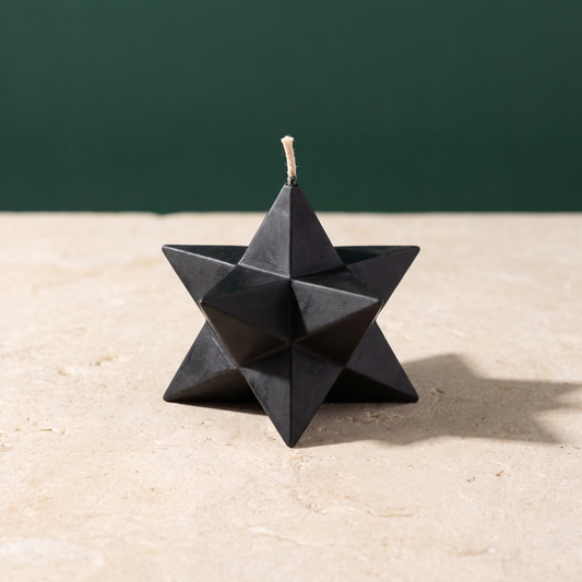 Beeswax Pentagram Merkaba spell candle standing upright, showing the pentagram and Merkaba sacred geometry