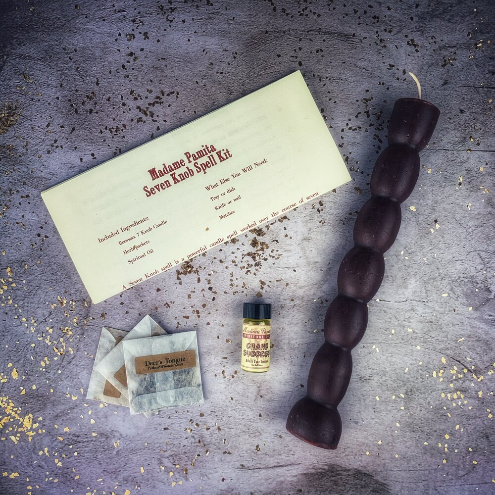 Seven knob candles shown in several of the ten available spell colors.