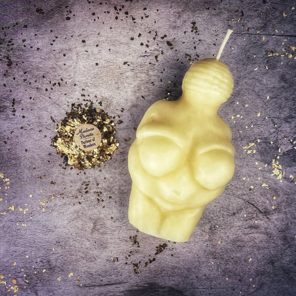 Goddess of Willendorf Candle Spell Kit components: beeswax goddess figure candle, herbs and spiritual oil