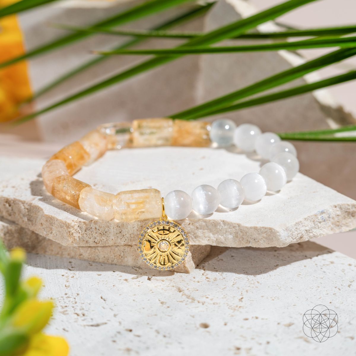 Citrine and selenite beaded bracelet with a gold-plated charm bearing the Eye of Horus, four-leaf clover, hamsa hand and horseshoe — view 5 of 8