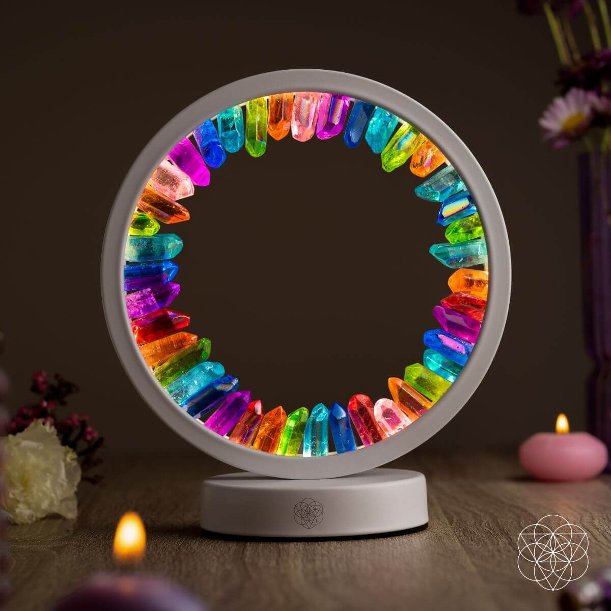 Halo-shaped lamp of rainbow aura-plated clear quartz points glowing in vivid colors