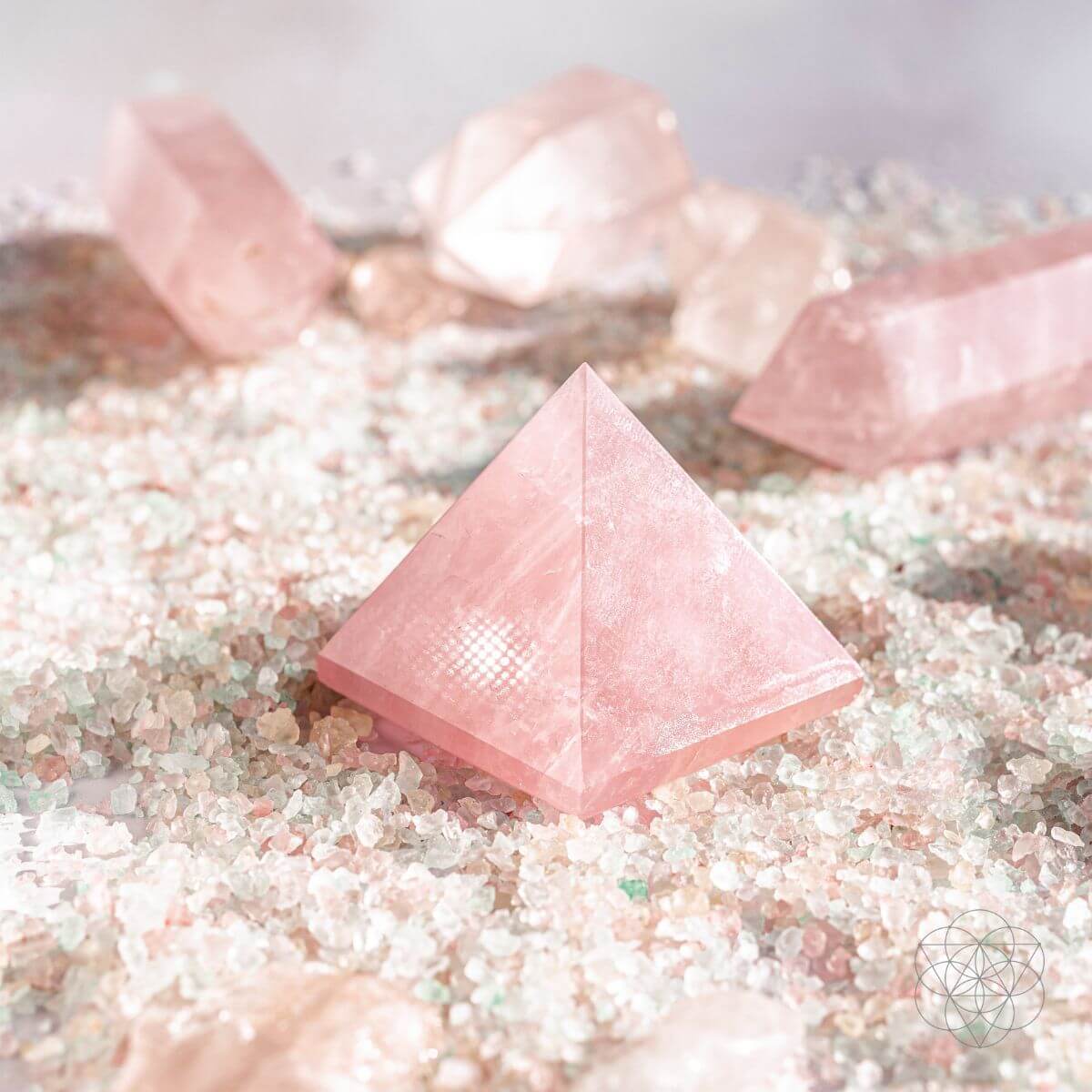 Polished natural rose quartz pyramid in soft pink