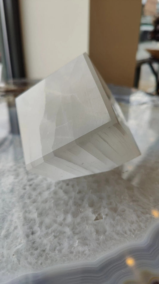 Standing cube of translucent white Moroccan selenite with fibrous vertical grain, 10 centimetres