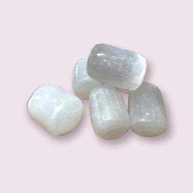 Tumbled Selenite stone with a pearlescent white surface and soft satin sheen