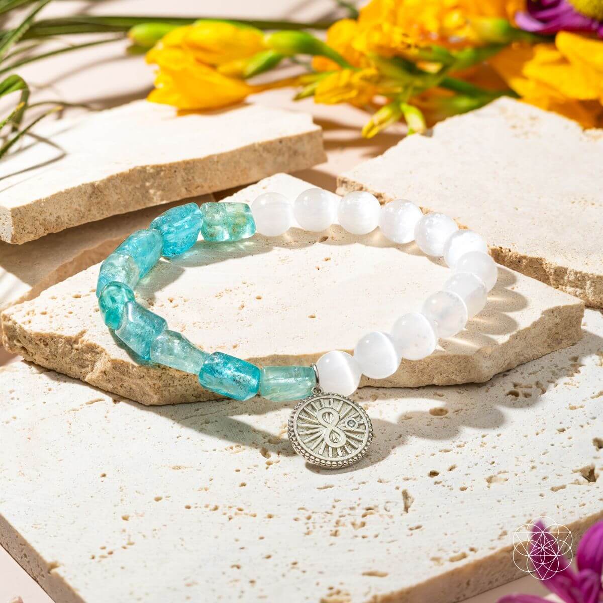 Bracelet with raw blue apatite and translucent selenite beads joined by a platinum-plated infinity charm