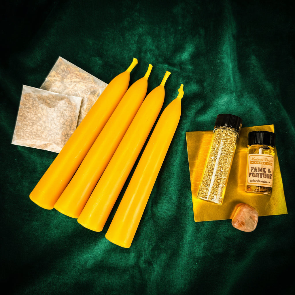 Spotlight Candle Spell Booster Pack with four yellow beeswax taper candles, Fame and Fortune oil, gold glitter, herbs and petition paper on green velvet