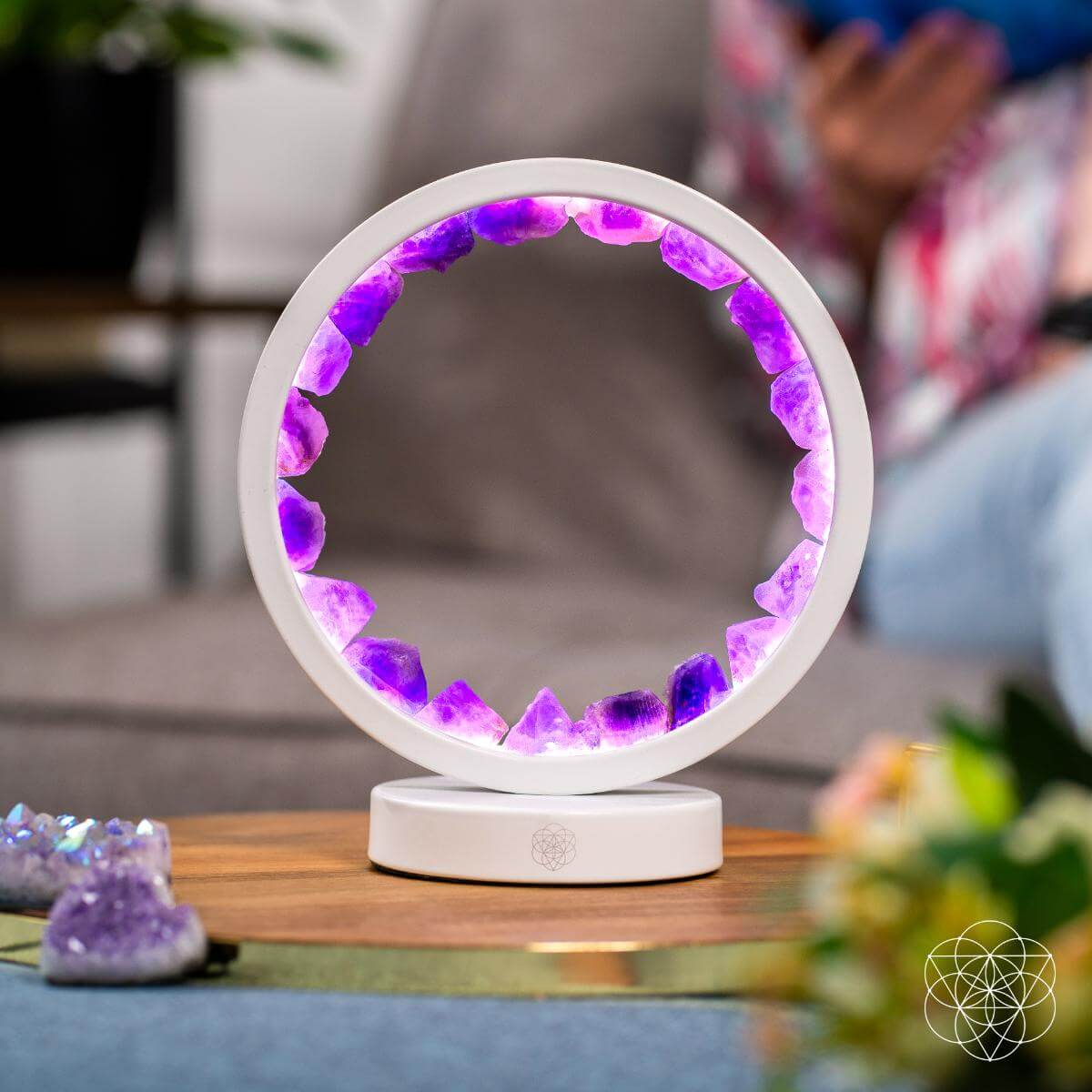Circular amethyst halo lamp glowing in soft purple light — detail view 4