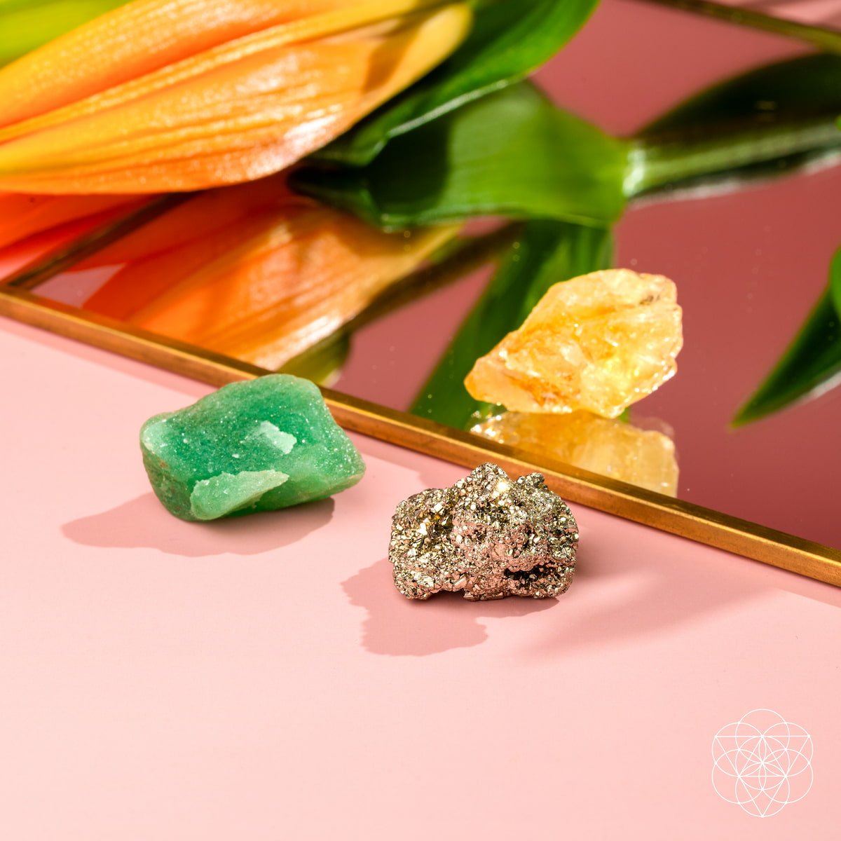Three raw abundance stones — golden Citrine, metallic Pyrite, and green Aventurine — view 4
