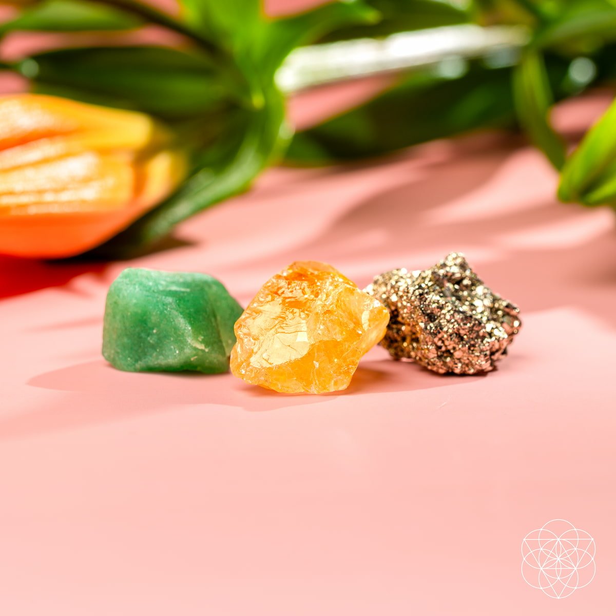 Three raw abundance stones — golden Citrine, metallic Pyrite, and green Aventurine — view 3