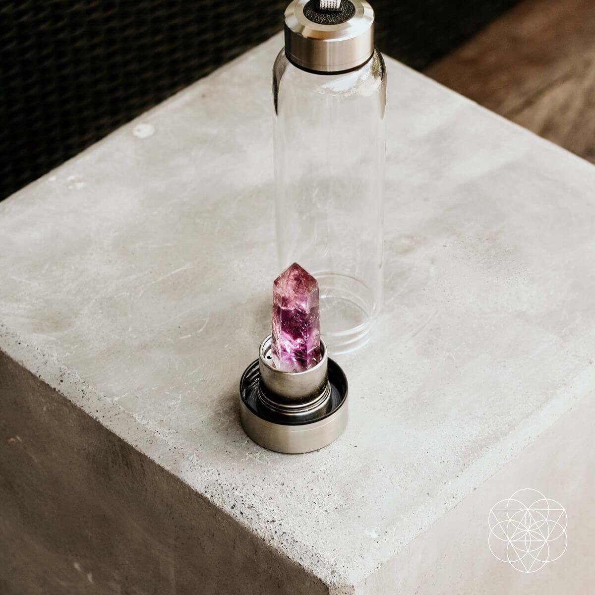 Glass water bottle with a natural amethyst crystal point set into the base — view 6 of 6