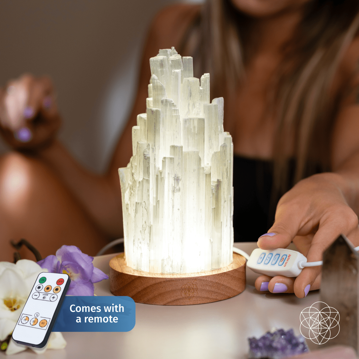 Tall Selenite crystal lamp glowing on a walnut base — view 2