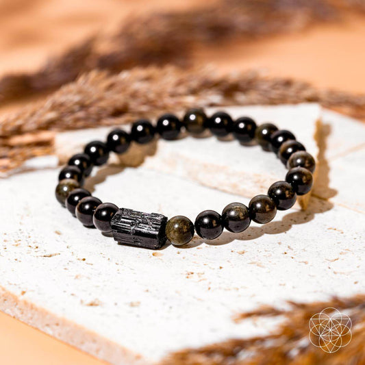 Bracelet of black tourmaline beads and golden obsidian beads with a warm sheen