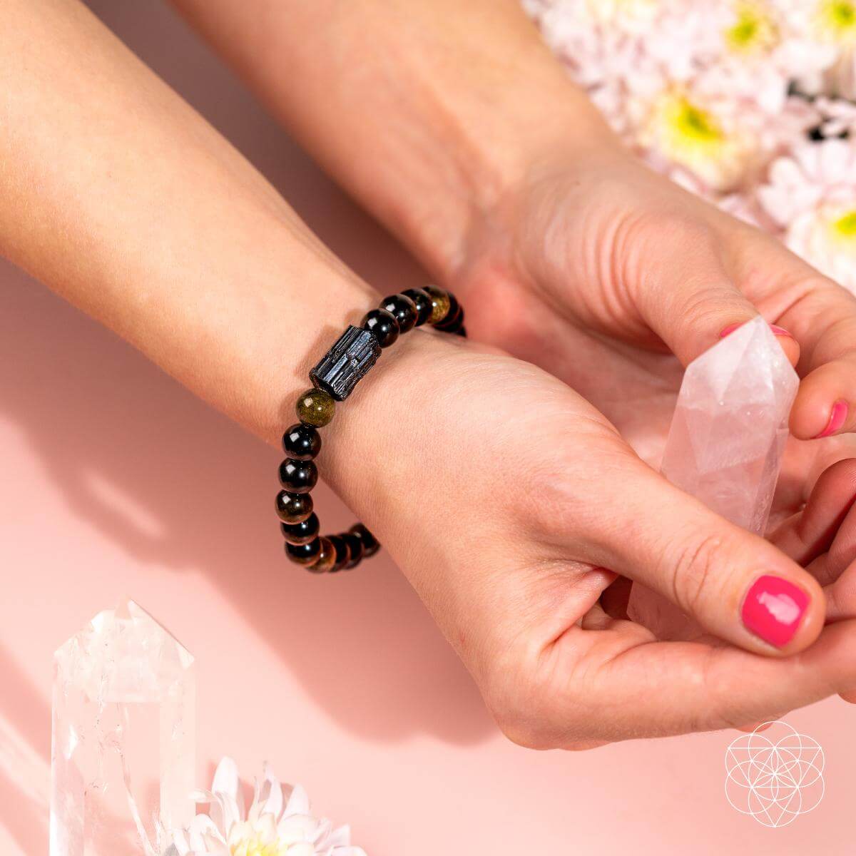 Bracelet of black tourmaline beads and golden obsidian beads with a warm sheen — detail view 2