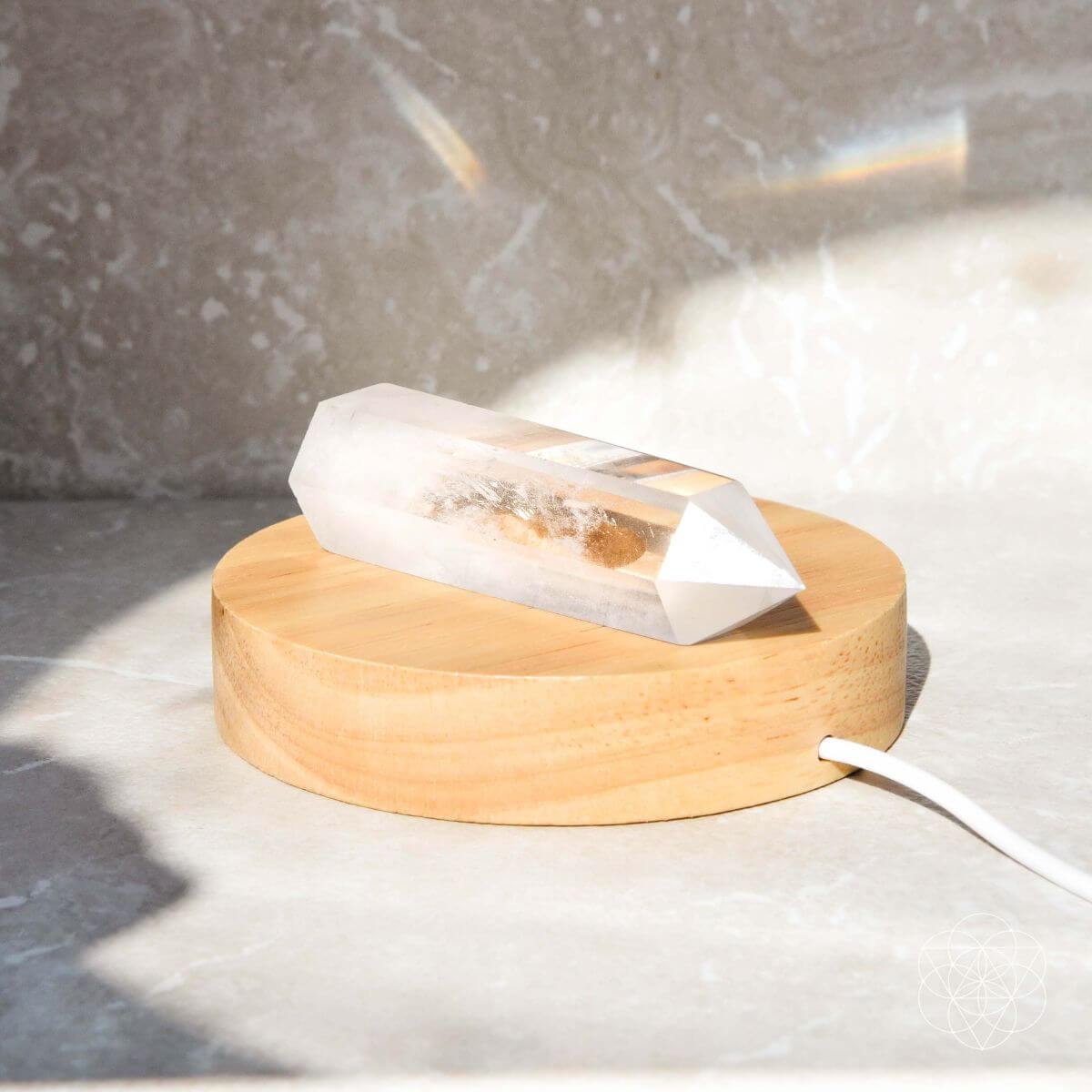 Clear quartz crystal lamp with a soft warm glow — detail view 6
