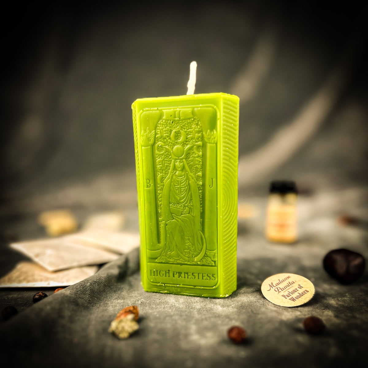 The High Priestess beeswax tarot candle in green with the kit oil bottle and instructions