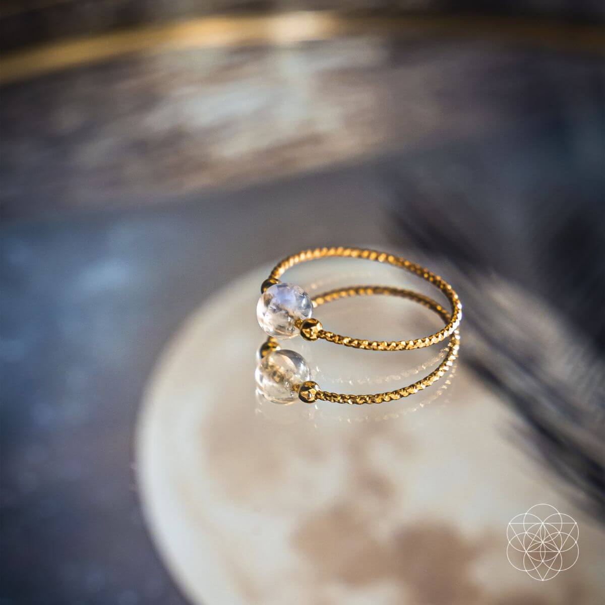 Elegant moonstone ring with a pearly white cabochon stone — view 1 of 6