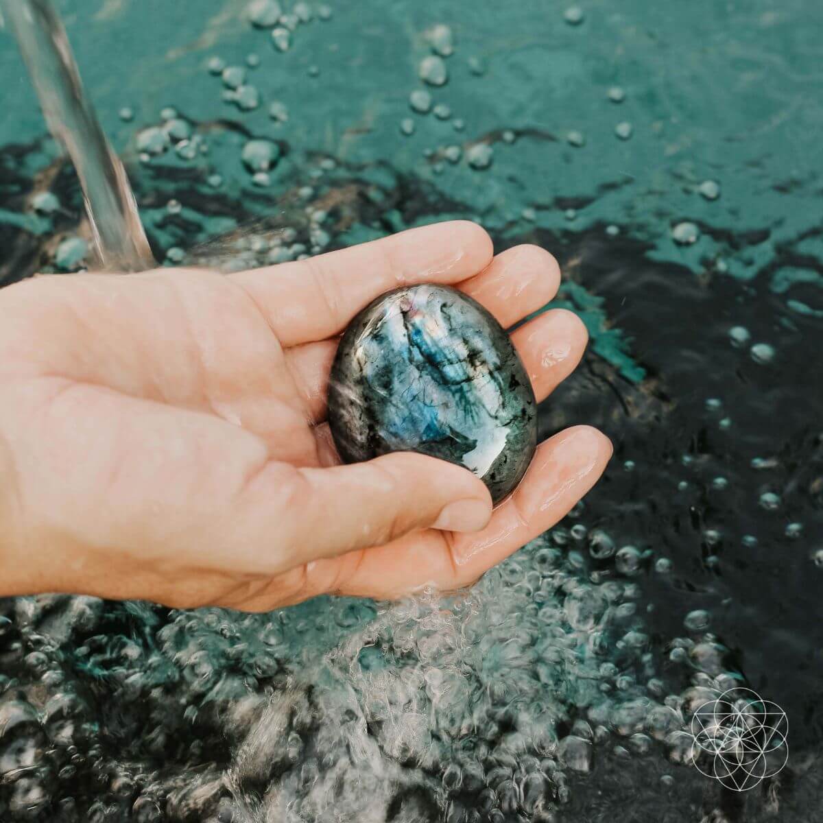 Raw labradorite stone shimmering with green and blue flashes — view 2 of 6