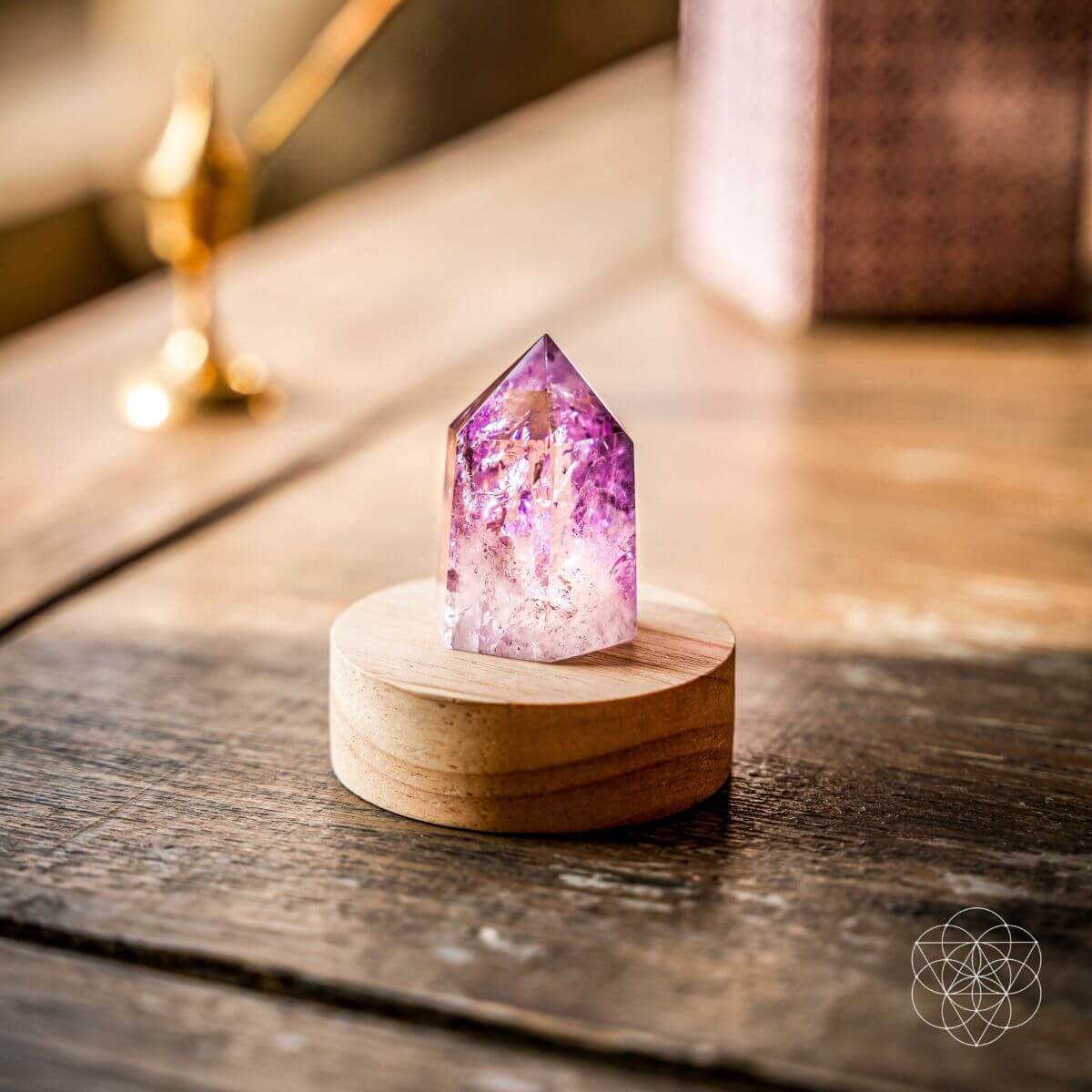 Amethyst crystal point lamp on a bedside table with soft purple light — view 6 of 7