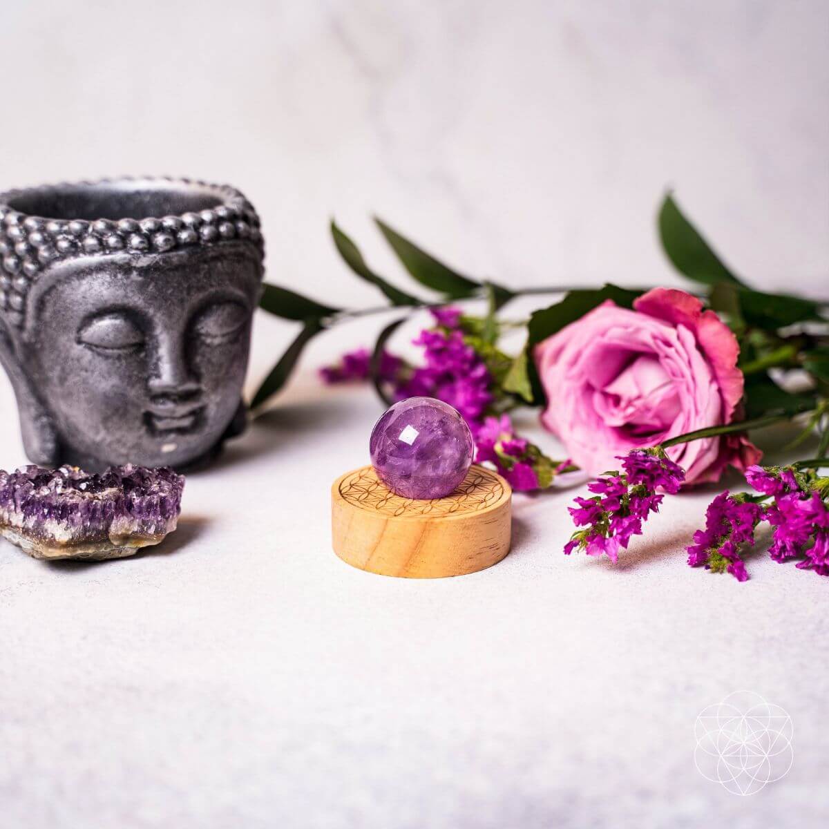 Amethyst crystal ball lamp on a Seed of Life patterned base, glowing warm pink — view 7 of 7