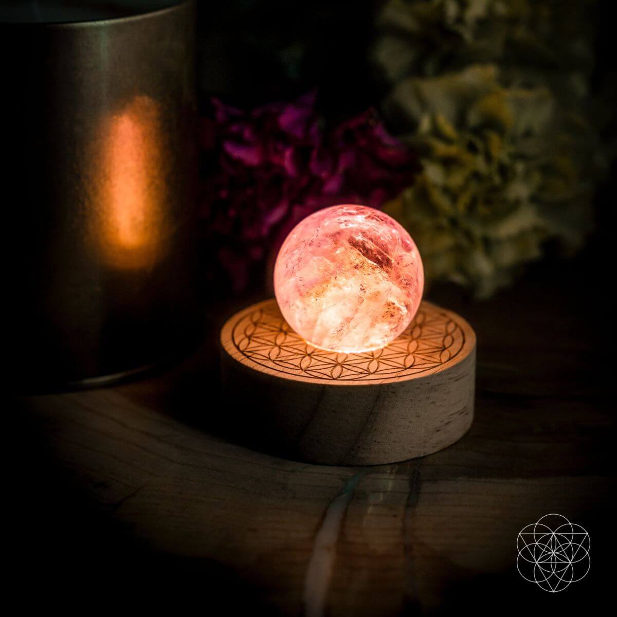 Amethyst crystal ball lamp on a Seed of Life patterned base, glowing warm pink — view 4 of 7