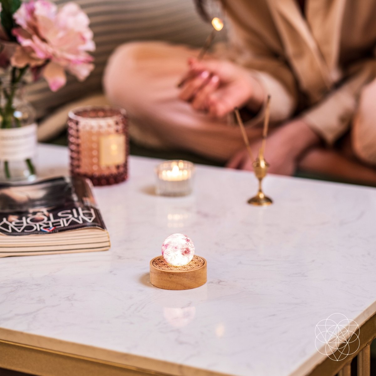 Amethyst crystal ball lamp on a Seed of Life patterned base, glowing warm pink — view 6 of 7