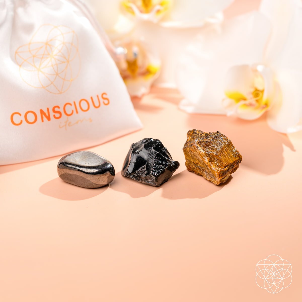 Three raw protection stones — black Obsidian, golden Tiger's Eye, and silver Hematite — view 5