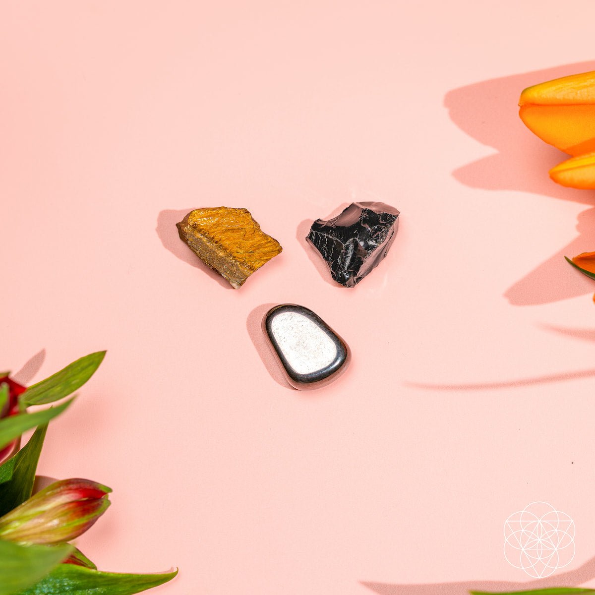 Three raw protection stones — black Obsidian, golden Tiger's Eye, and silver Hematite — view 6