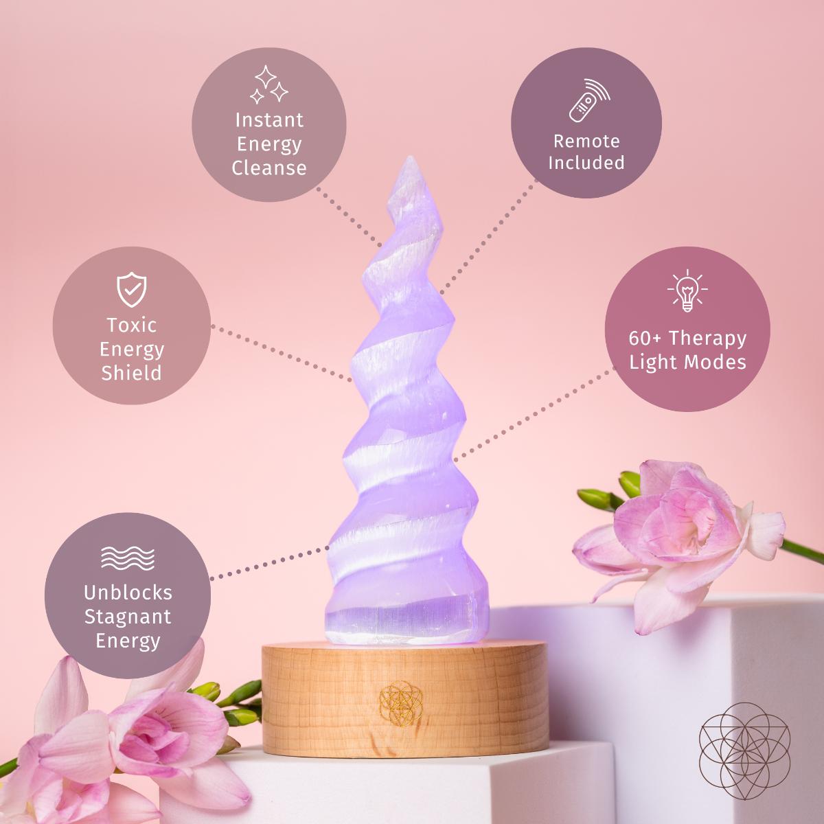 Handmade selenite flame lamp rising from a wooden base, lit in soft color — detail view 4